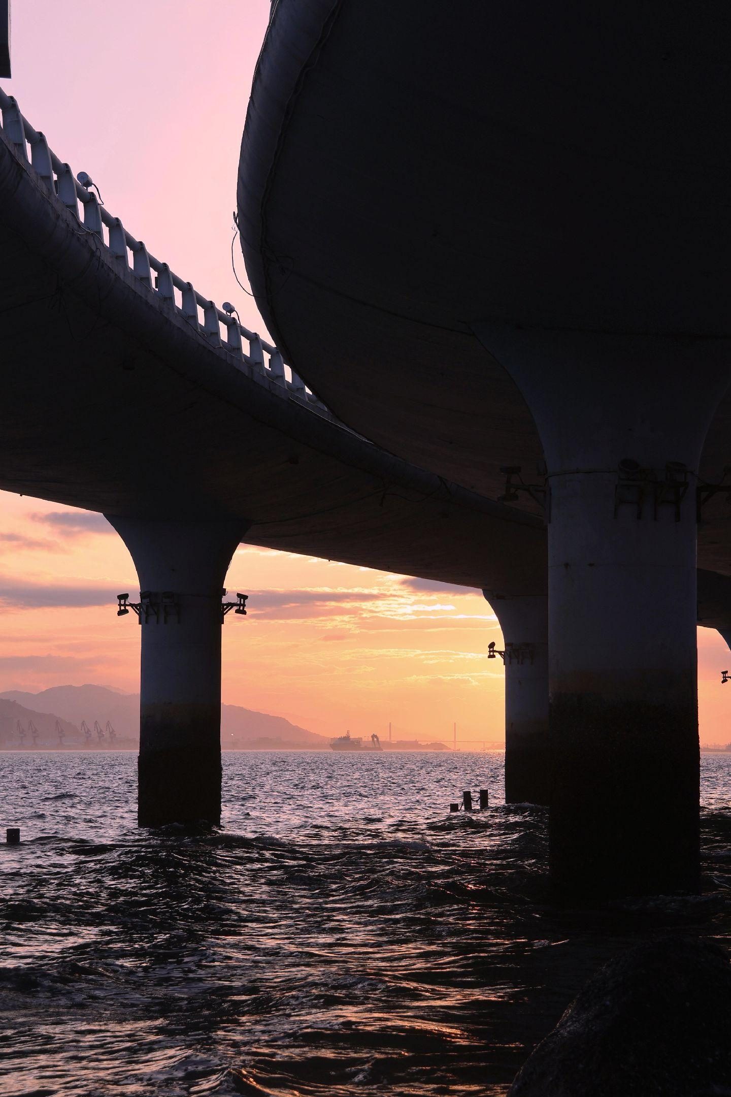 Sunset seen from beneath a sea bridge on the Xiamen coast